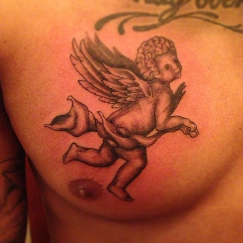 Grey Ink Flying Baby Angel Tattoo On Man Chest